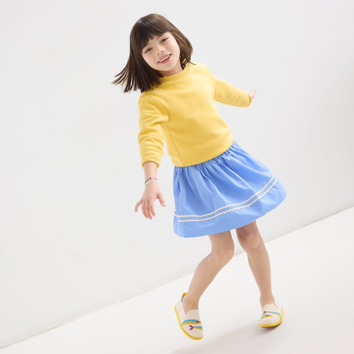 model | An alternate image of a model wearing The Mini Loafer in Silly Sardine.