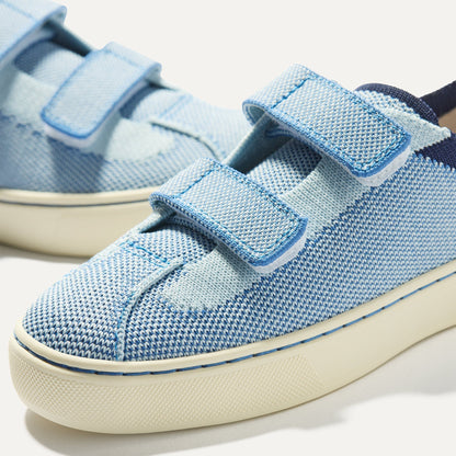 Close up of the vamp of The Kids Strap Sneaker in Berry Blue.