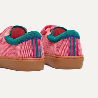 Close up of the heel of The Kids Strap Sneaker in Watermelon, with Rothy's signature blue halo.