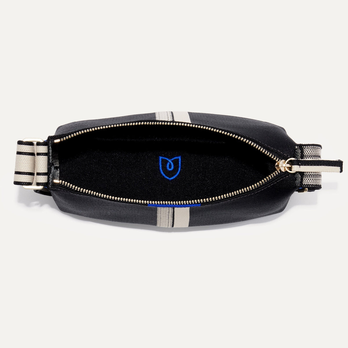 The Casual Crossbody in Black & Ivory Stripe, shown from above, with the interior exposed.