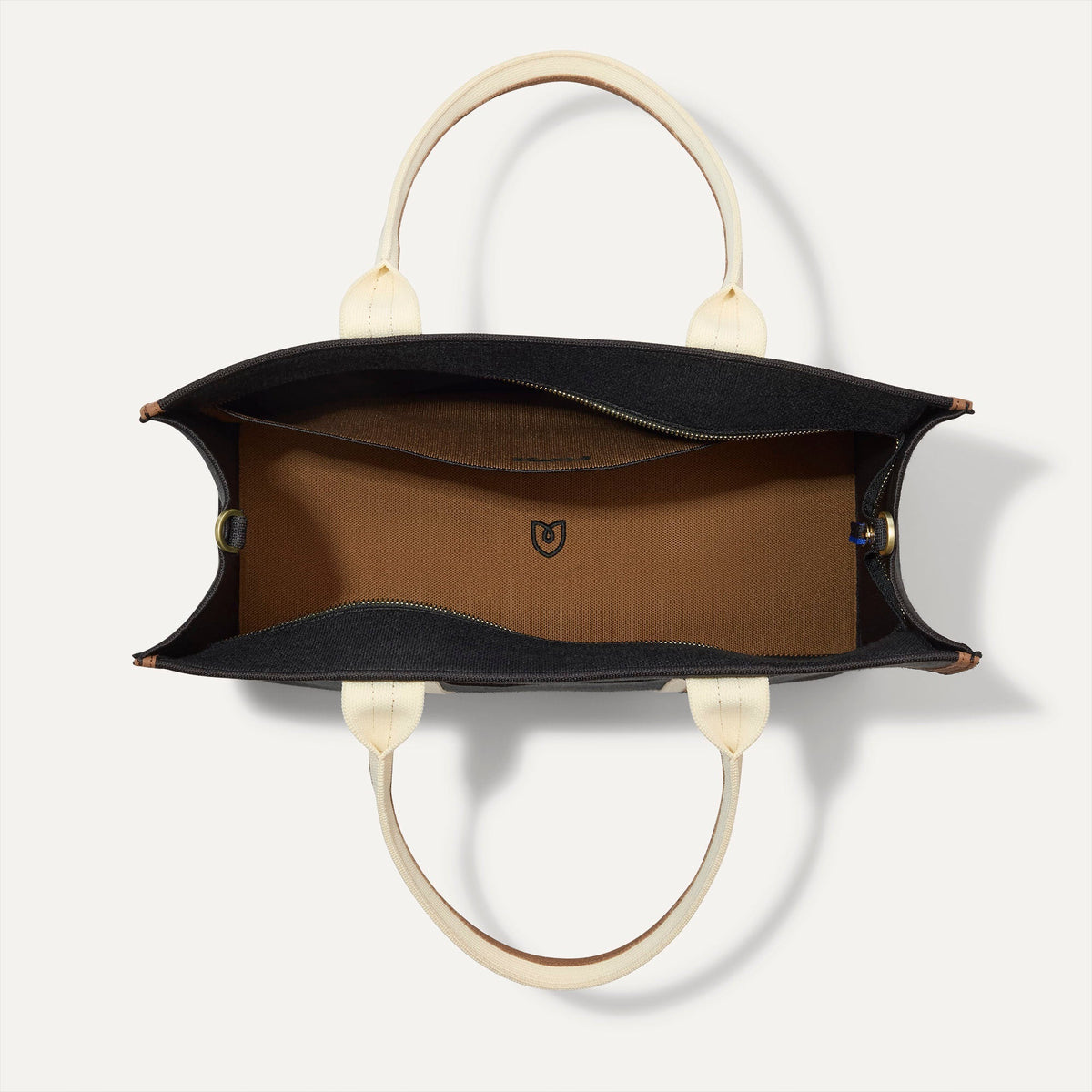 The Classic Tote in Black Coffee, shown from above, with the interior exposed.