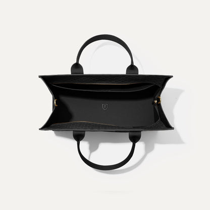 The Classic Tote in Black Sand, shown from above, with the interior exposed.