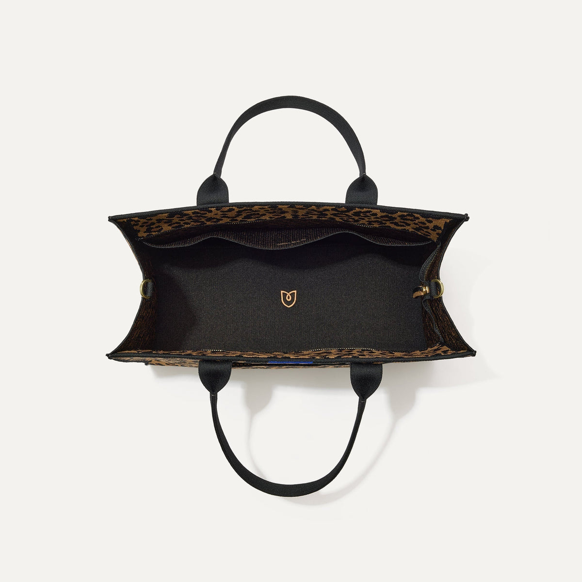 The Classic Tote in Toasty Cat, shown from above, with the interior exposed.