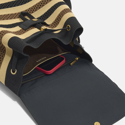 A close up of the interior pocket on The Cinch Backpack in Mocha Stripe Crochet