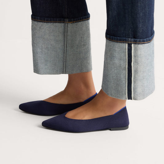 hover | Model wearing The Point III in Navy.