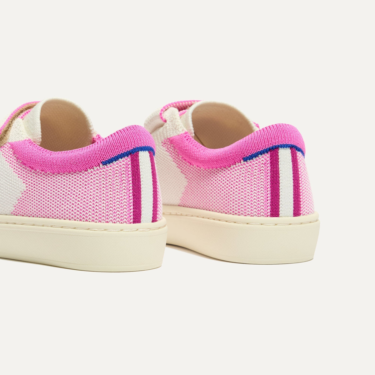 Close up of the heel of The Kids Strap Sneaker in Pink Taffy, with Rothy's signature blue halo.