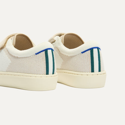 Close up of the heel of The Kids Strap Sneaker in Vanilla Ice, with Rothy's signature blue halo.