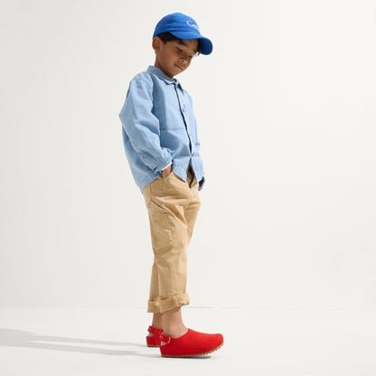 model | Alternate view of a child wearing The Kids Clog in Firetruck Red.