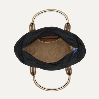 The Travel Tote in Ink, shown from above with the interior exposed.