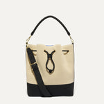 PLP |The Cinch Bucket Bag in Black and White Raffia-Knit shown from the front.
