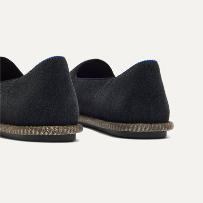 Close up of the heel of The Cruiser Loafer in ReVelvet Black, with Rothy's signature blue halo.