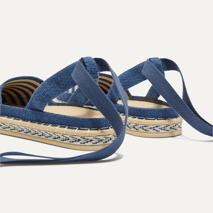 Close up of the heel of The D'Orsay Espadrille in Deep Sea Stripe, showing removable ankle straps.