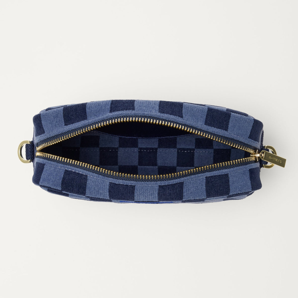 The Crossbody Camera Bag in ReVelvet™ Blue Ink, shown from above, with the interior exposed.