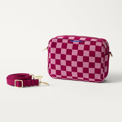 The Crossbody Camera Bag in ReVelvet™ Orchid shown by itself with removable strap.