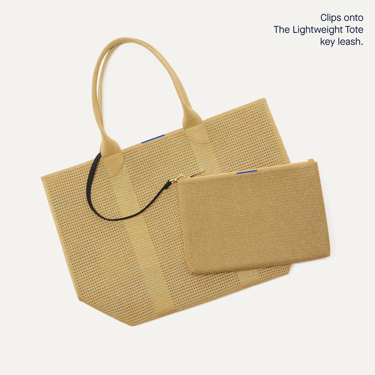 The Convertible Clutch in Glitzy Gold focusing on the strap.