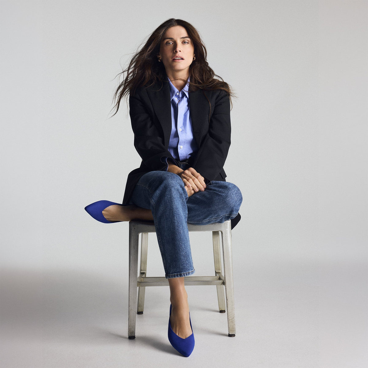 Overlay:: Elisa Sednaoui wears The Point III in Rothy's Blue. | Alt: model | Alternate view of a model wearing The Point III in Rothy's Blue.